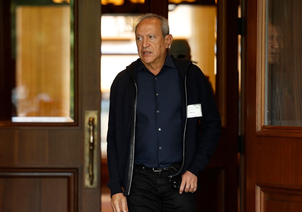 Man in black shirt walks outside