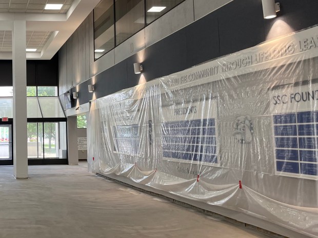 A wall recognizing South Suburban College leaders was added to the updated student atrium, where renovations continued on June 30, 2025. (Olivia Stevens/Daily Southtown)