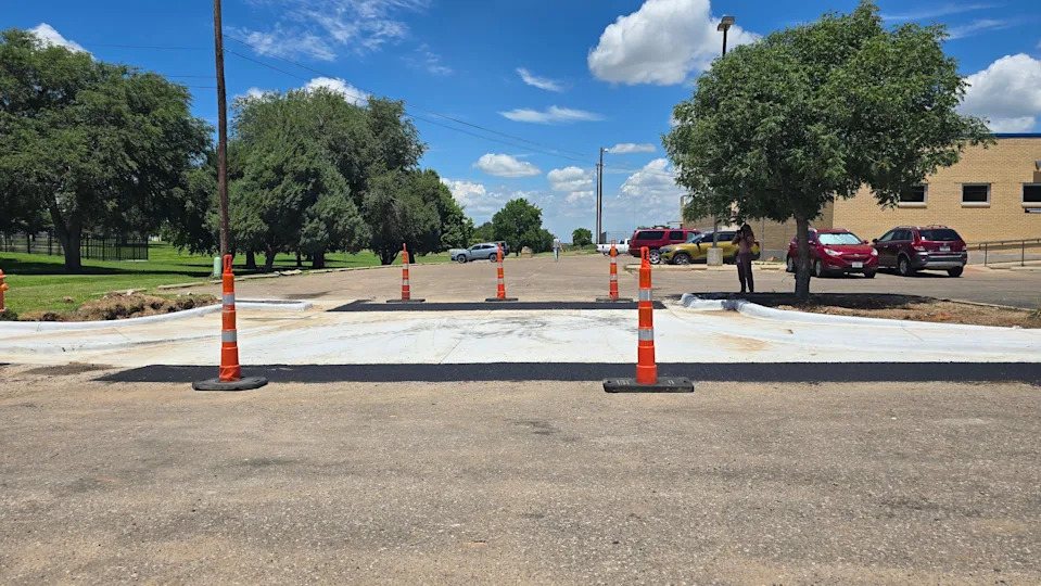 Fresh concrete marks the recently completed sidewalk section outside the Charles E. Warford Activity Center along Northwest 18th Avenue. The improvements are part of a $430,000 project funded through federal and neighborhood contributions.