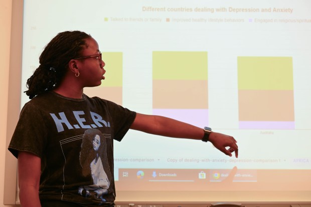 Building 21 graduate Laniya Anderson, 18, presents a project during...