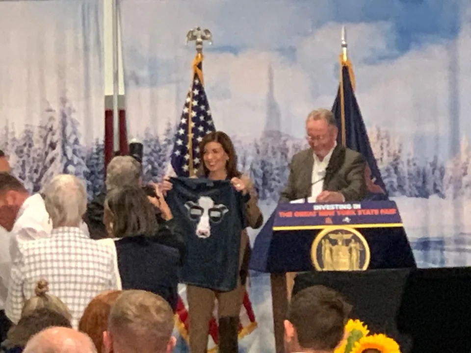 Hochul holding up a cow shirt at the New York State Fair. Vaughn Golden/NY Post
