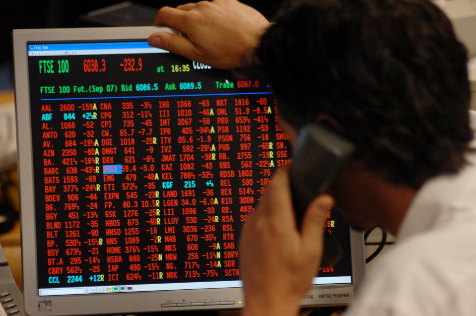 Person on phone viewing stock market data showing significant losses.