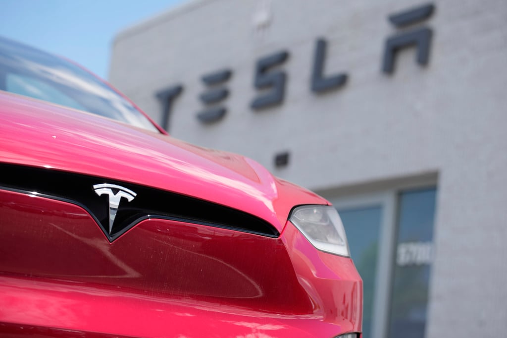 An unsold Model X sports utility vehicle sits outside a Tesla showroom in Littleton, Colorado. Photo: AP